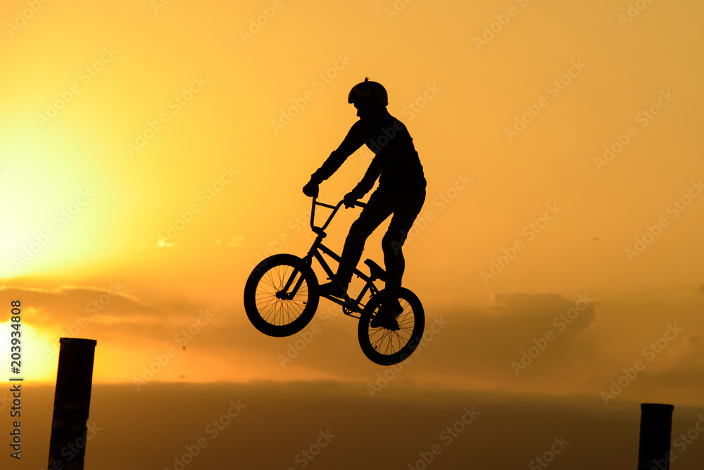Fototapeta premium Bicycle rider making a bike jump.