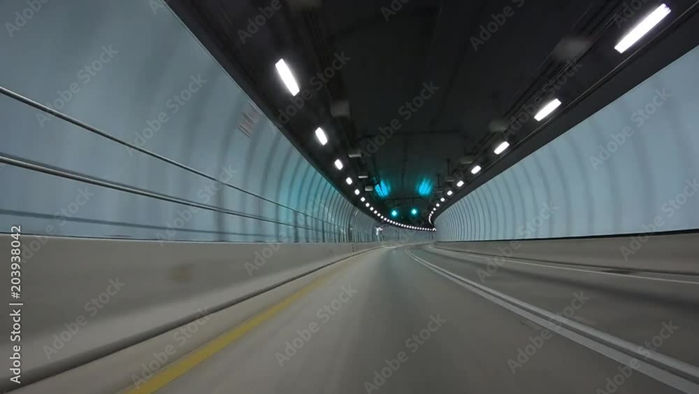 Driving fast inside empty city tunnel, view from moving car. Business concept Driving fast inside empty city tunnel, view from moving car. Business concept