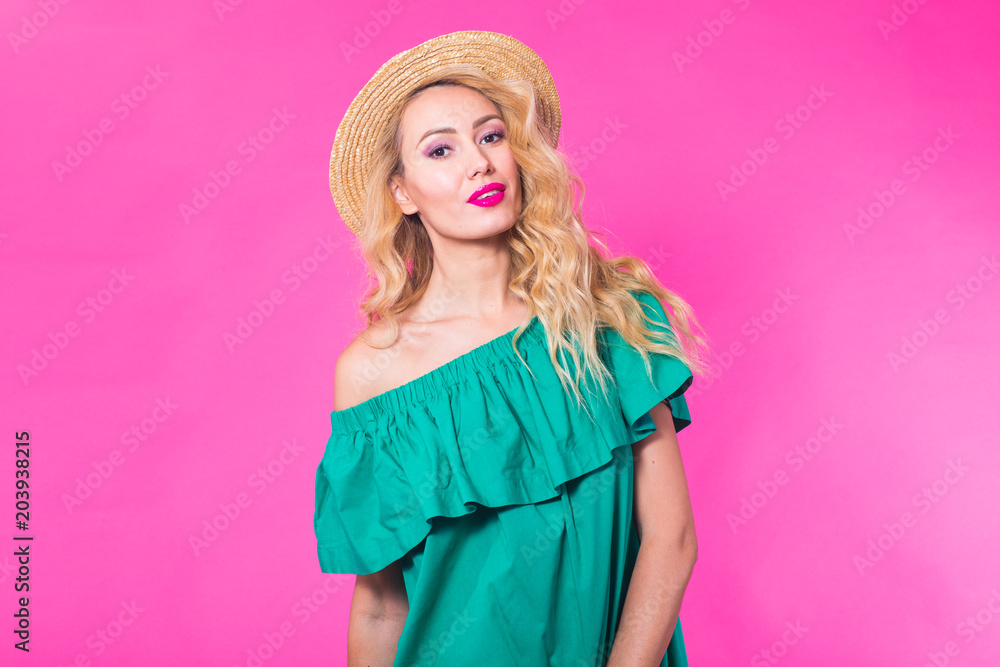 People, positive emotions, facial expressions and lifestyle concept. Young woman with curly hair against pink background, smiles happily People, positive emotions, facial expressions and lifestyle concept. Young woman with curly hair against pink background, smiles happily