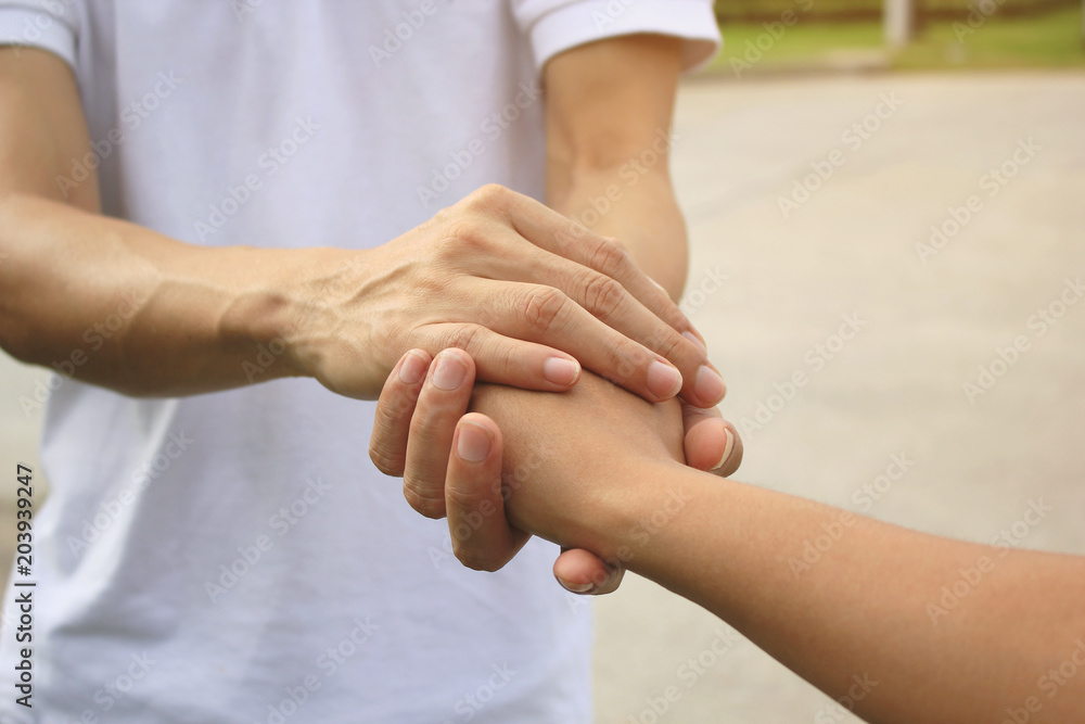 Man and woman holding hands of romantic couple in love