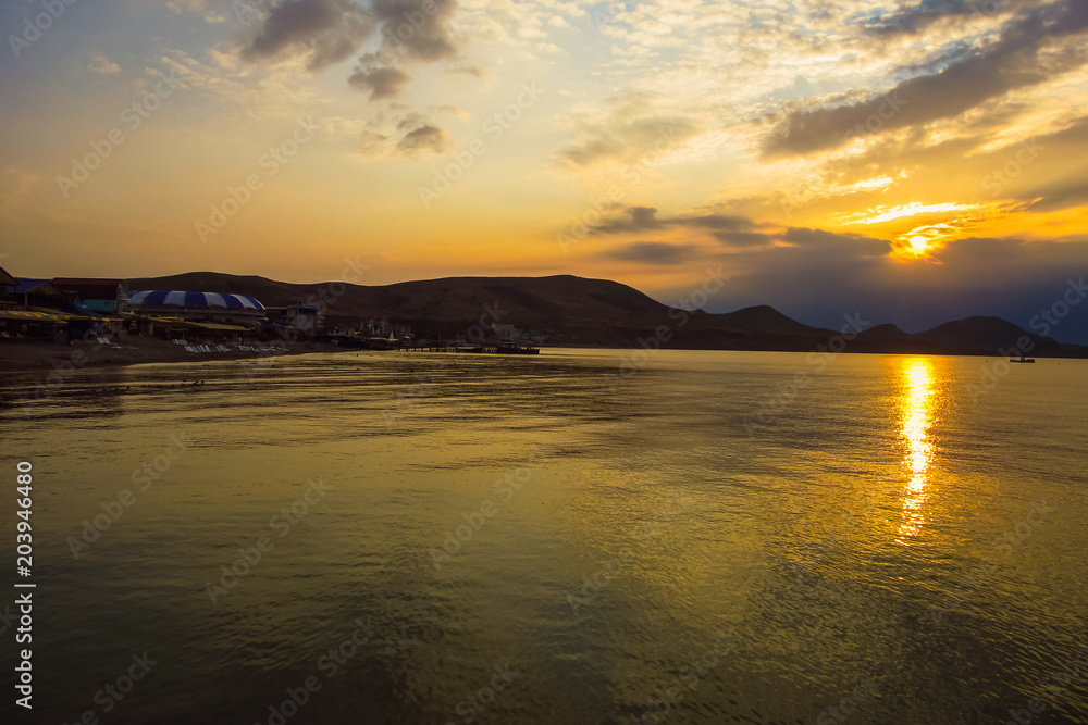 Sunset. Solar path on the sea water. Cape Hamelion. Crimea