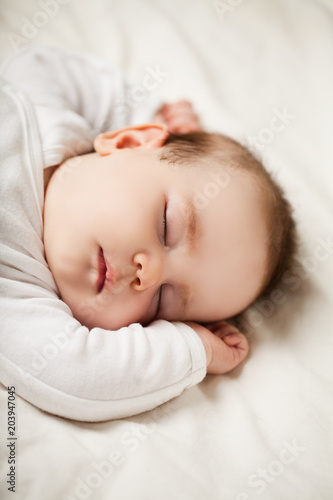 Sleeping newborn baby at home, bedtime