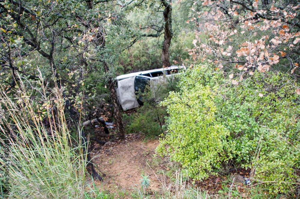 Rumpled car in a ditch.