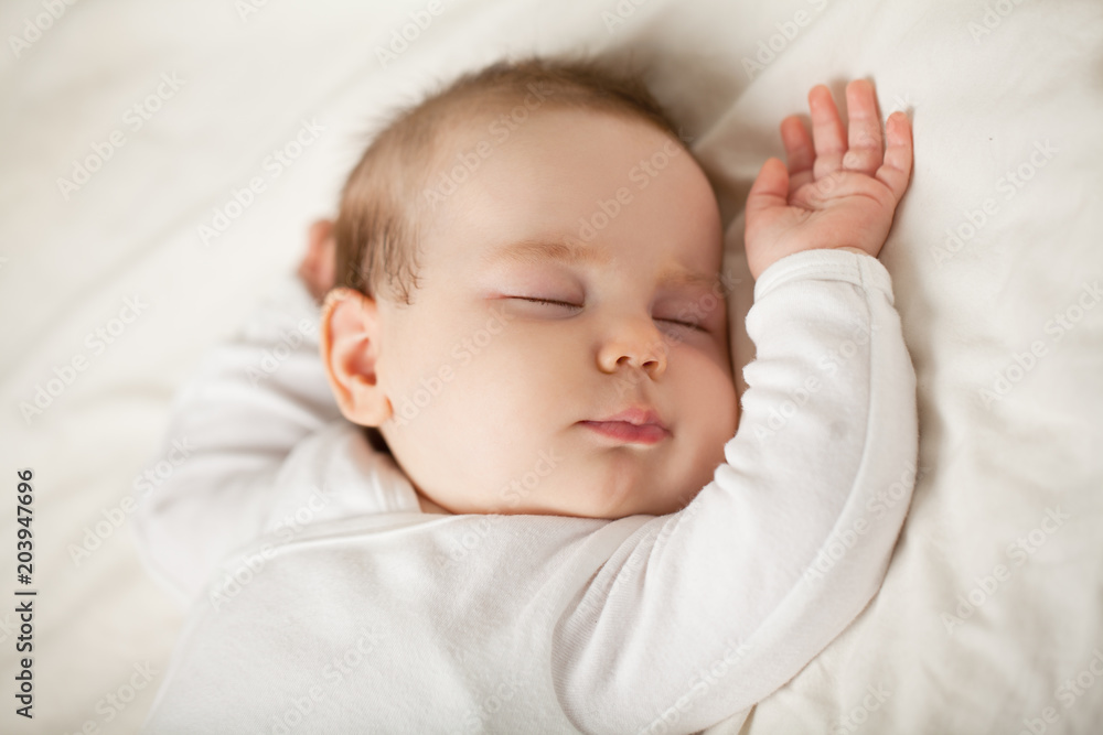Sleeping newborn baby on white background. Small sleeping child, bedtime (baby up to one month) Sleeping newborn baby on white background. Small sleeping child, bedtime (baby up to one month)