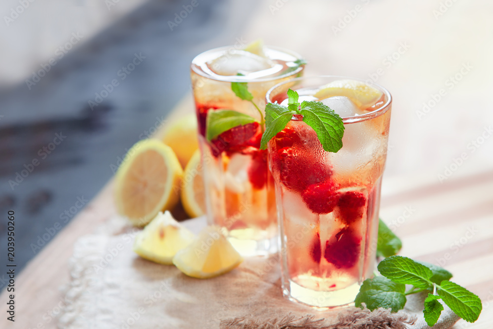 Refreshing summer drink with raspberry, mint and ice copy space Refreshing summer drink with raspberry, mint and ice copy space