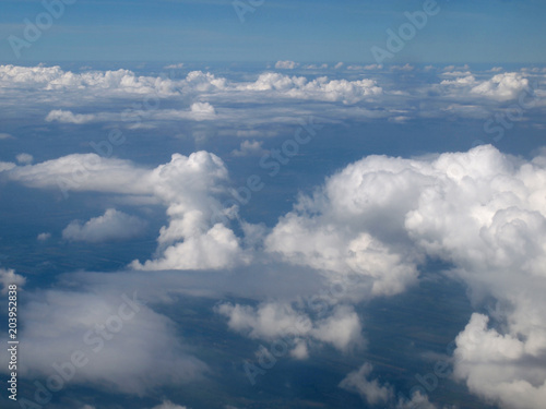 Fototapeta Naklejka Na Ścianę i Meble -  Blue sky with clouds, a view from airplane window