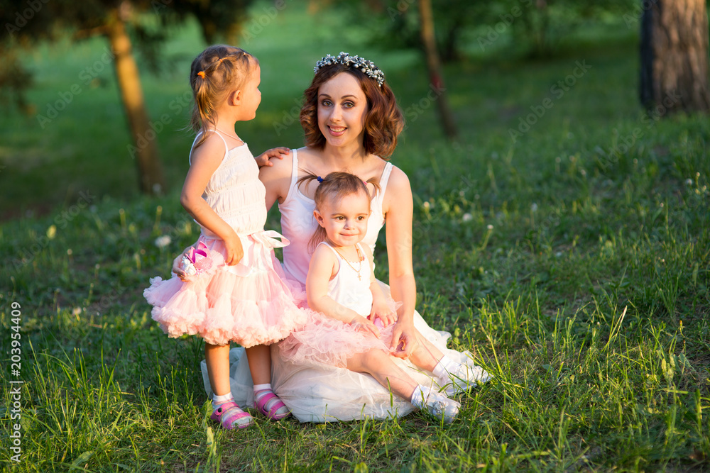 Naklejka premium woman and children in nature