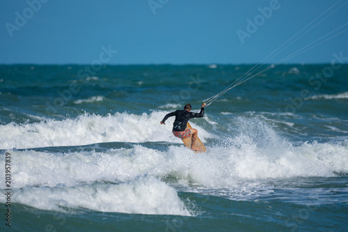 unknown kite boarder heads out to sea © J.A.