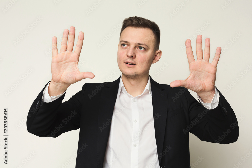 Young businessman using virtual screen for work Young businessman using virtual screen for work