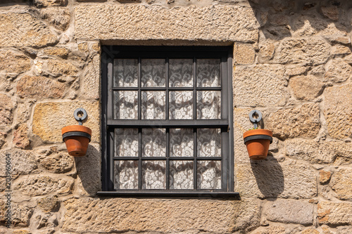 Typical window on the facade of an old house photo