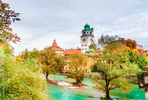 Munich, Germany - autumn view of Isar river with the Muellersches volksbad photo