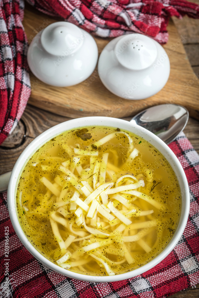 Broth - chicken soup in a bowl. Broth - chicken soup in a bowl.