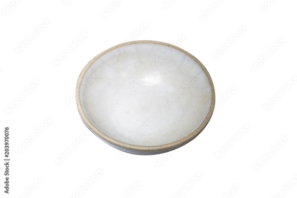 White dish isolated on wood background.Closed up.Clipping path White dish isolated on wood background.Closed up.Clipping path