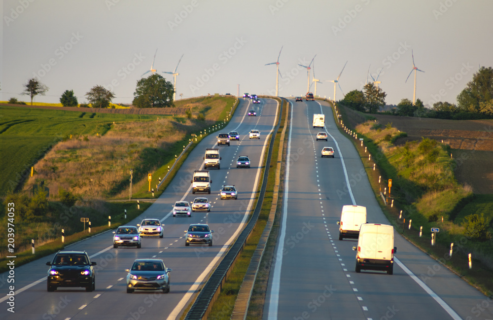 Car traffic on the motorway in Germany before sunset