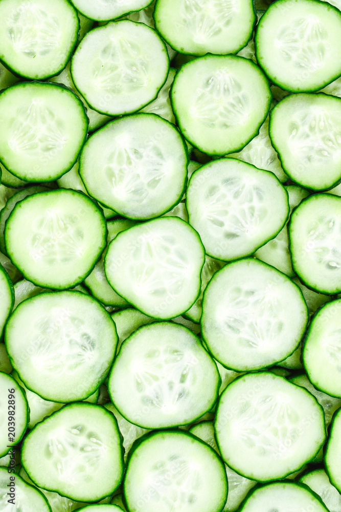Fresh green slices of cucumber as background Fresh green slices of cucumber as background