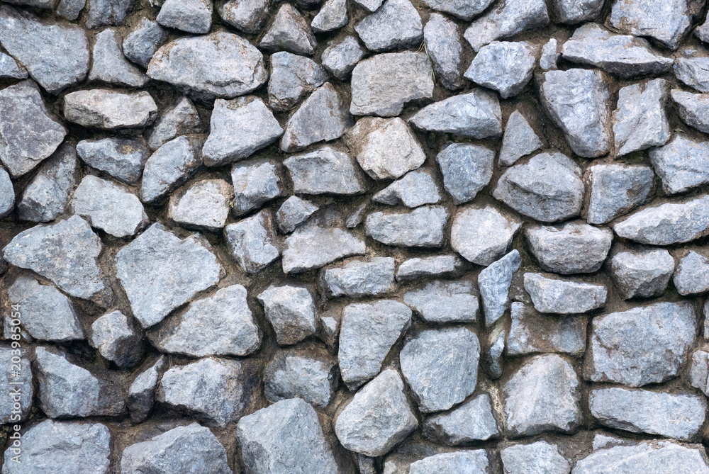 Photo of the wall made of decorative stone for the textured background Photo of the wall made of decorative stone for the textured background