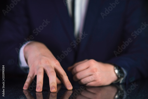 Businessman hands on table when he explaines something