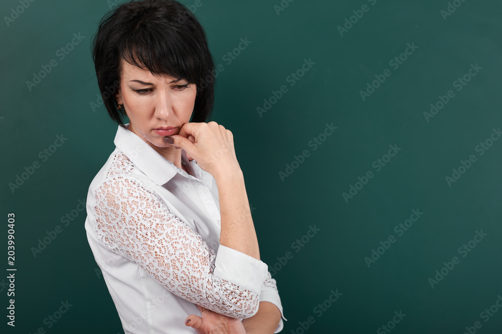 woman posing and thinking on school Board background, learning concept, Studio shot woman posing and thinking on school Board background, learning concept, Studio shot