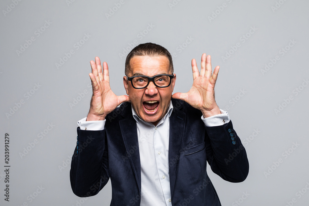Announcing good news. Happy young man in formalwear shouting while looking at camera and standing isolated on white background Announcing good news. Happy young man in formalwear shouting while looking at camera and standing isolated on white background