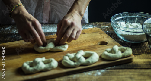 Dough dainted by the woman on the board