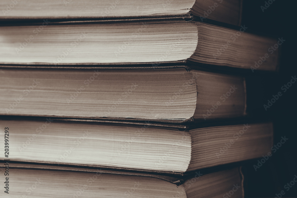 vertical stack of books background toned vertical stack of books background toned