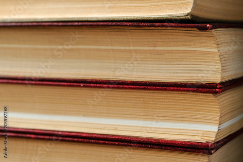 Close-up vertical stack of books background