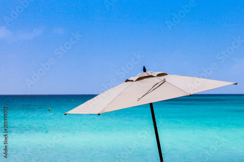 Umbrella with blue sky and ocean