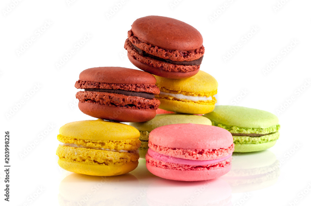 Macaron cakes of different colors on a white background Macaron cakes of different colors on a white background