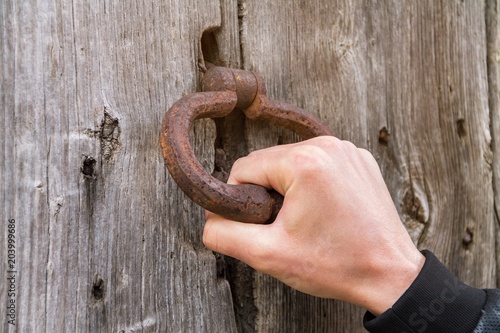 Принти на полотні An ancient handmade door bell, A knock at the door, a wooden door