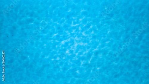 Ripple Water in swimming pool witn sun reflection © artjazz