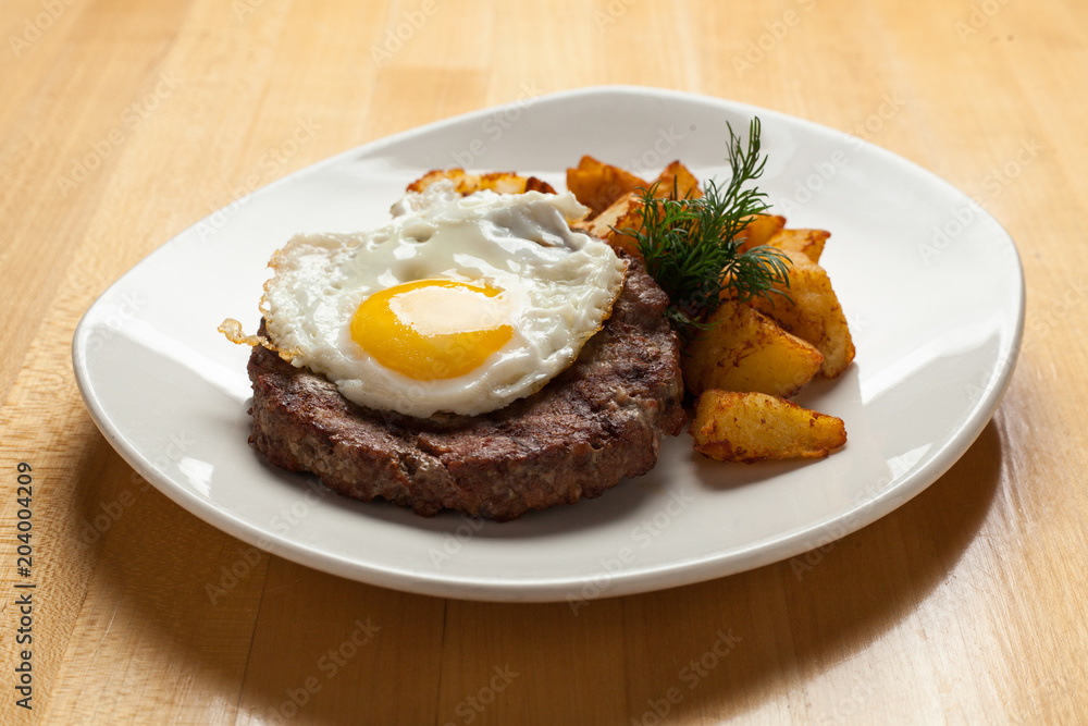 fried meat with egg and potatoes fried meat with egg and potatoes