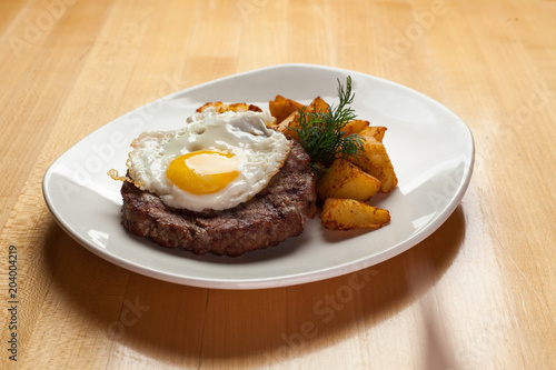  fried meat with egg and potatoes