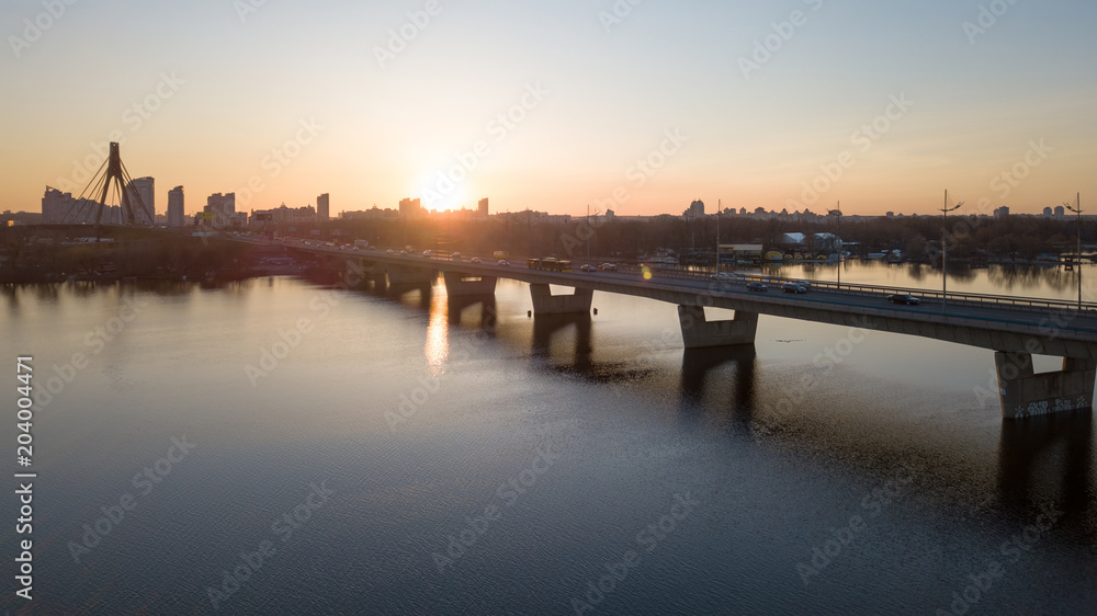 Sunset of north bridge over the Dnieper River, Kiev.