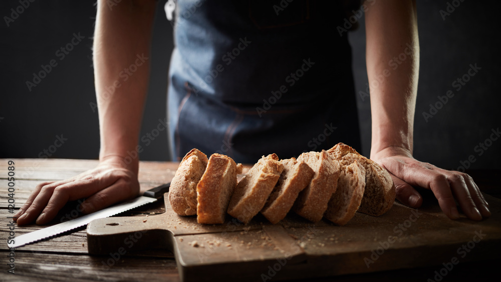 Whole grain bread put on a kitchen plate with a chef,