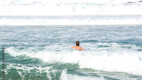 Swimming in the furious waves of Bondi beach in sydney