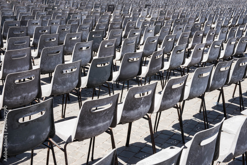 Naklejka premium Empty grey seats in large stadium auditorium