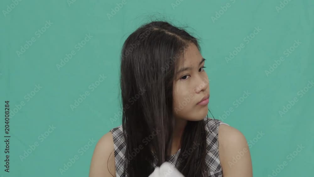 Happy little girl wipes her hairs with a towel, Green screen
Happy little girl wipes her hairs with a towel, Green screen