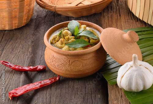 Green curry on wooden background