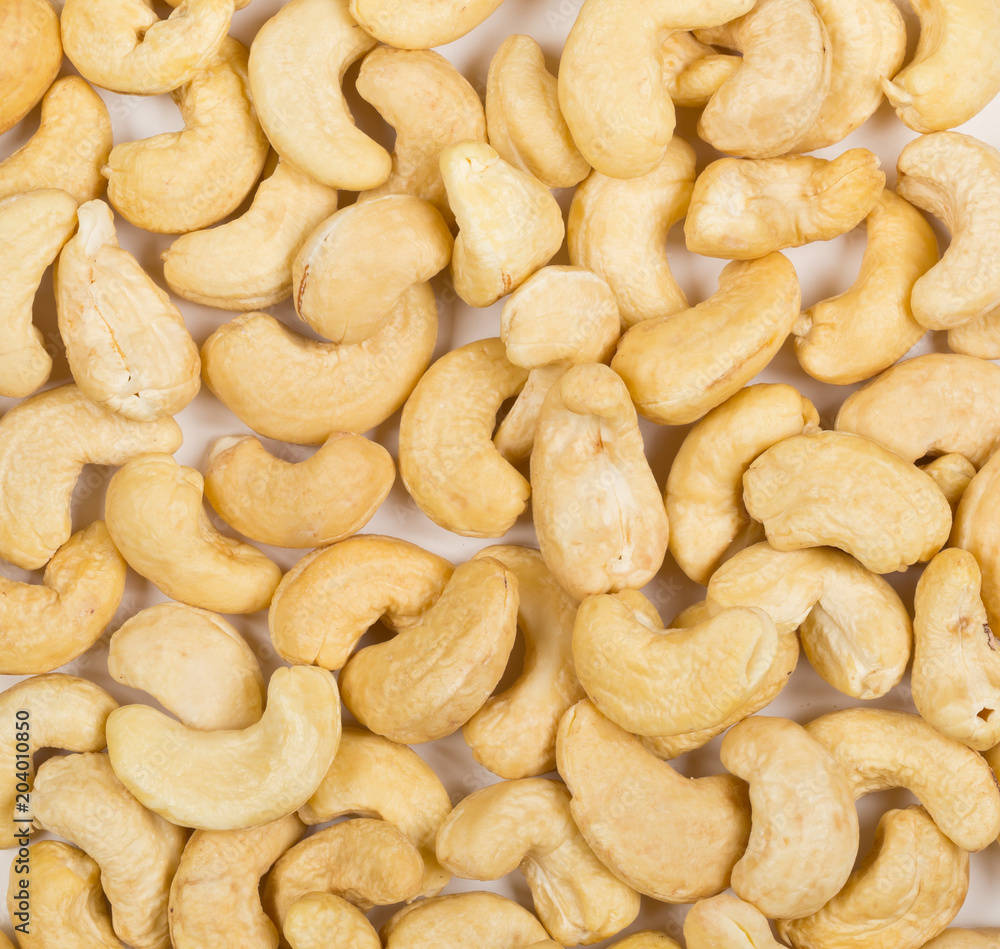 Heap of raw, organic, whole cashew nut kernels from above Heap of raw, organic, whole cashew nut kernels from above