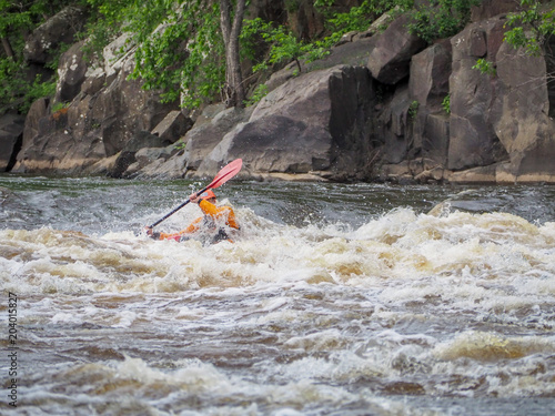 Whitewater kayaking- navigating through the rapids photo