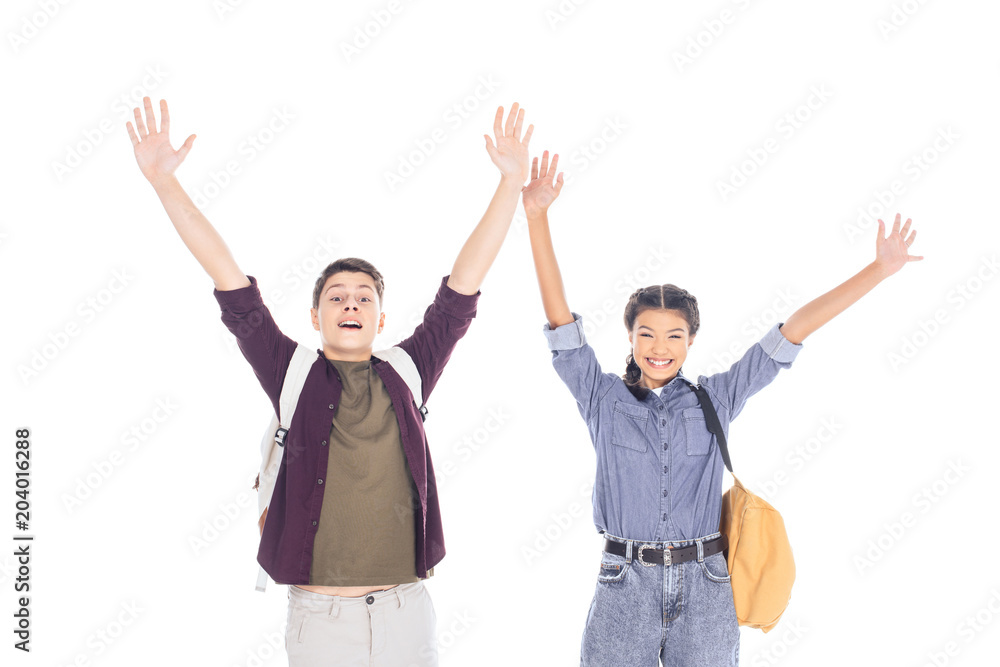 portrait of excited teenagers with backpacks outstretching arms isolated on white portrait of excited teenagers with backpacks outstretching arms isolated on white