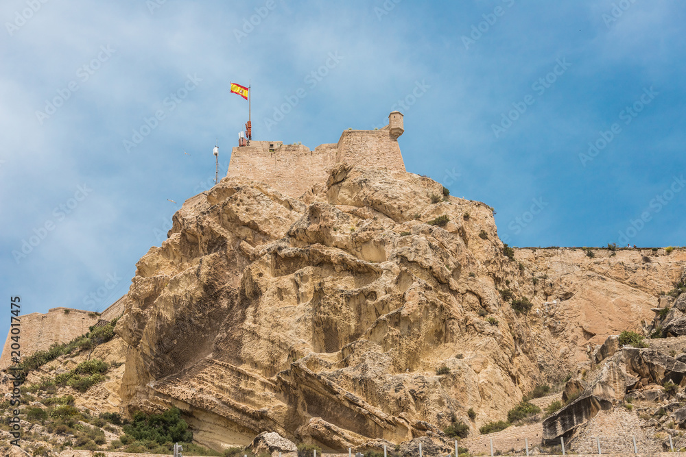 Tower viewpoints of the Castle of Santa Barbara on top of the stones very high seen from below in Alicante, Spain