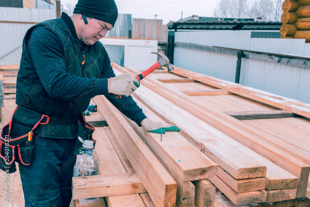 Builder with a hammer