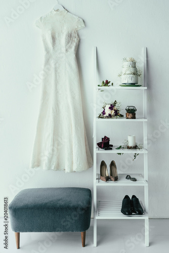close up view of bridal and grooms clothing and accessories for rustic wedding in room