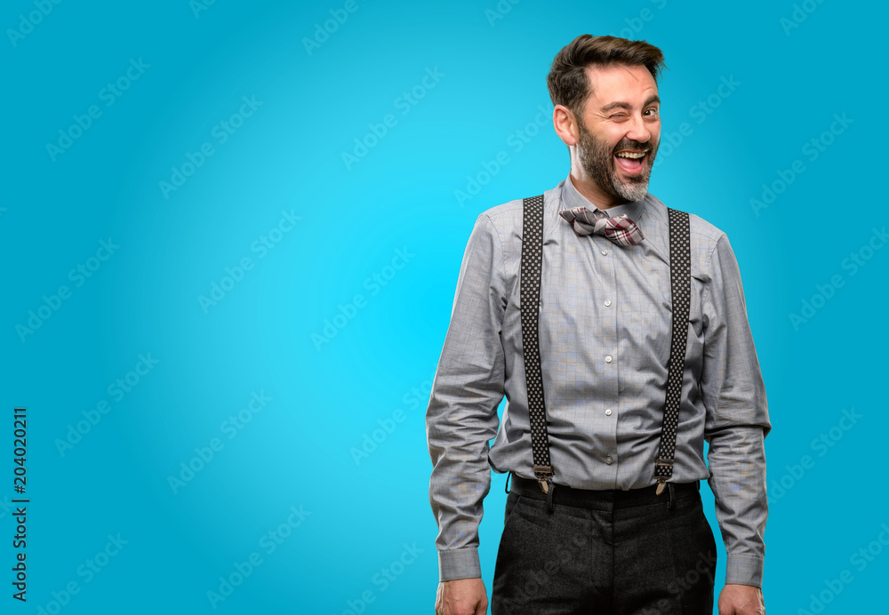 Middle age man, with beard and bow tie blinking eyes with happy gesture Middle age man, with beard and bow tie blinking eyes with happy gesture