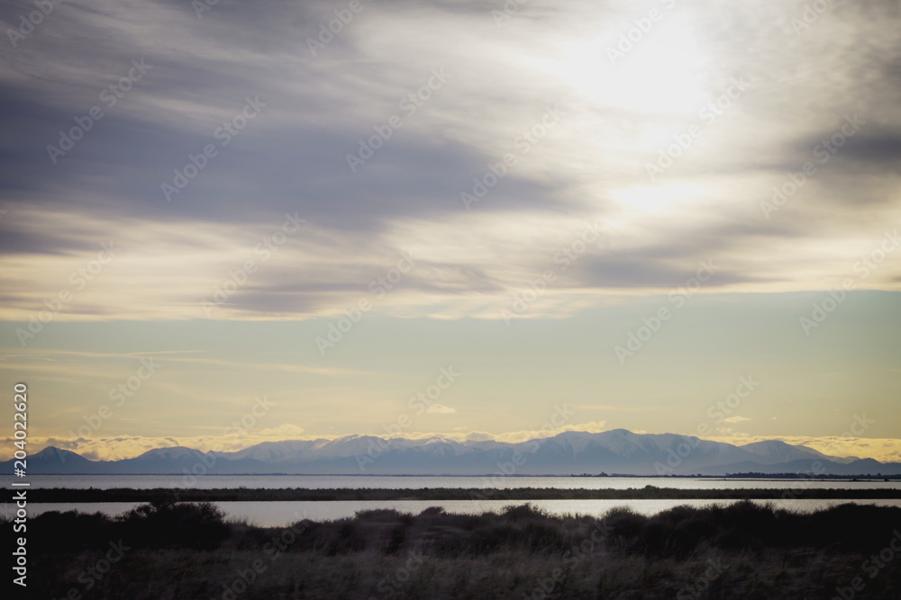 Looking out over Lake Ellesmere towards the Southern Alps of New Zealand.