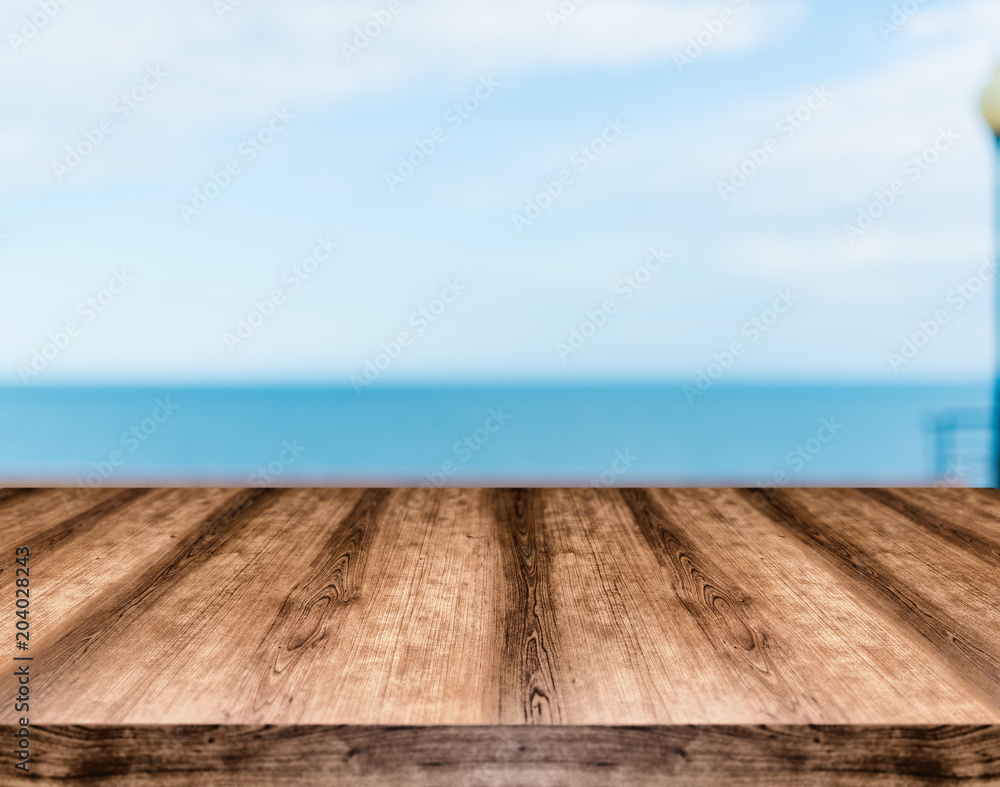 Wooden empty table board in front of blurred background. Can be used for display or montage any product. Mock up for display your product. Wooden empty table board in front of blurred background. Can be used for display or montage any product. Mock up for display your product.