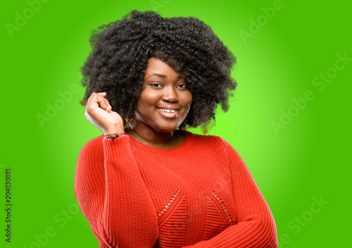 Beautiful african woman confident and happy with a big natural smile laughing