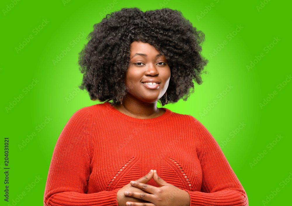 Beautiful african woman confident and happy with a big natural smile laughing Beautiful african woman confident and happy with a big natural smile laughing