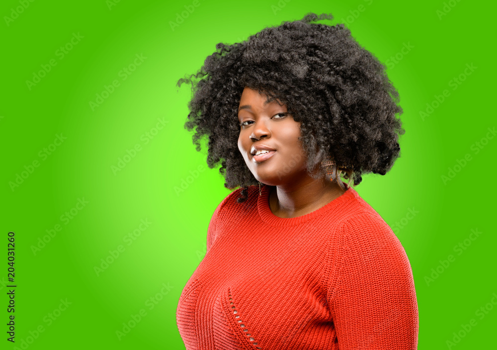 Beautiful african woman confident and happy with a big natural smile laughing Beautiful african woman confident and happy with a big natural smile laughing